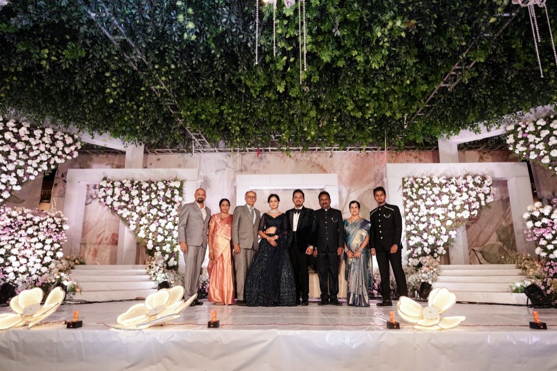 Floral wedding stage with hanging greenery styled by SGR Decorators